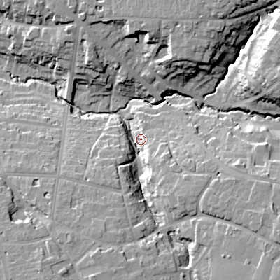 Shaded relief map of the ground around GL538BE, computed from Environment Agency LiDAR. The ground here sits at about 77 m above sea level and falls 24 m across the surrounding 800 m. Surface water reaching this point runs off ground lying to the south-east, 18.8 m higher.