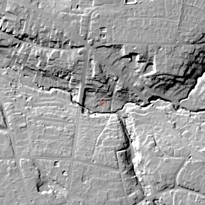 Shaded relief map of the ground around GL538BN, computed from Environment Agency LiDAR. The ground here sits at about 74 m above sea level and falls 26 m across the surrounding 800 m. Surface water reaching this point runs off ground lying to the north-north-west, 12.4 m higher.