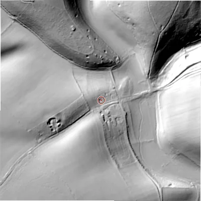 Shaded relief map of the ground around GL541EX, computed from Environment Agency LiDAR. The ground here sits at about 184 m above sea level and falls 49 m across the surrounding 800 m. Surface water reaching this point runs off ground lying to the south-west, 35.2 m higher.