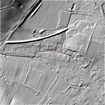 Shaded relief map of the ground around GL542AR, computed from Environment Agency LiDAR. The ground here sits at about 131 m above sea level and falls 26 m across the surrounding 800 m. Surface water reaching this point runs off ground lying to the west-north-west, 6.6 m higher.