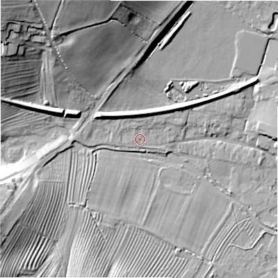 Shaded relief map of the ground around GL542AT, computed from Environment Agency LiDAR. The ground here sits at about 132 m above sea level and falls 28 m across the surrounding 800 m. Surface water reaching this point runs off ground lying to the north-north-west, 5.4 m higher.