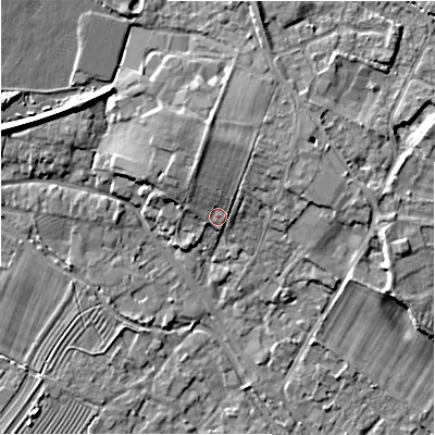 Shaded relief map of the ground around GL542AW, computed from Environment Agency LiDAR. The ground here sits at about 133 m above sea level and falls 8 m across the surrounding 800 m. Surface water reaching this point runs off ground lying to the north, 4.6 m higher.