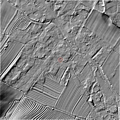 Shaded relief map of the ground around GL542DN, computed from Environment Agency LiDAR. The ground here sits at about 129 m above sea level and falls 11 m across the surrounding 800 m. Surface water reaching this point runs off ground lying to the east-north-east, 1.2 m higher.