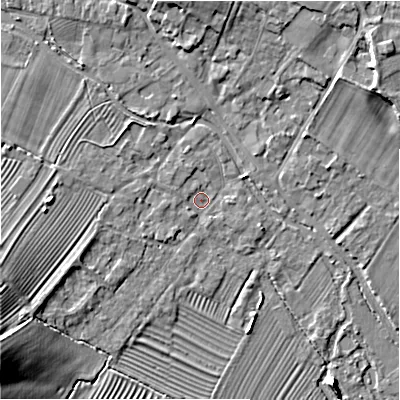 Shaded relief map of the ground around GL542FE, computed from Environment Agency LiDAR. The ground here sits at about 129 m above sea level and falls 16 m across the surrounding 800 m. Surface water reaching this point runs off ground lying to the west-south-west, 2.4 m higher.