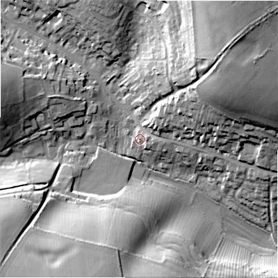 Shaded relief map of the ground around GL543EP, computed from Environment Agency LiDAR. The ground here sits at about 163 m above sea level and falls 38 m across the surrounding 800 m. Surface water reaching this point runs off ground lying to the east, 3.6 m higher.