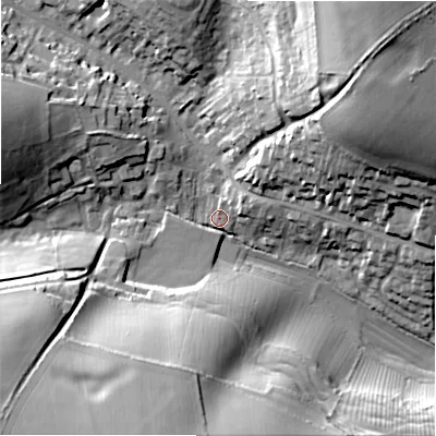 Shaded relief map of the ground around GL543ER, computed from Environment Agency LiDAR. The ground here sits at about 162 m above sea level and falls 38 m across the surrounding 800 m. Surface water reaching this point runs off ground lying to the north-east, 33.9 m higher.
