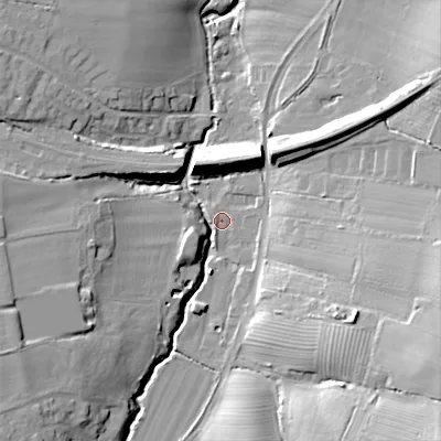Shaded relief map of the ground around GL545NS, computed from Environment Agency LiDAR. The ground here sits at about 74 m above sea level and falls 31 m across the surrounding 800 m. Surface water reaching this point runs off ground lying to the south-east, 25.2 m higher.