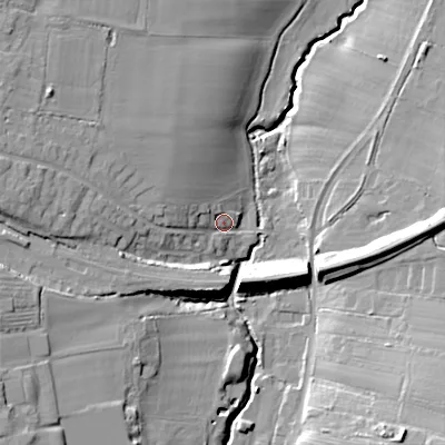 Shaded relief map of the ground around GL545NU, computed from Environment Agency LiDAR. The ground here sits at about 77 m above sea level and falls 22 m across the surrounding 800 m. Surface water reaching this point runs off ground lying to the west-north-west, 15.4 m higher.