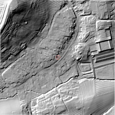 Shaded relief map of the ground around GL556AG, computed from Environment Agency LiDAR. The ground here sits at about 143 m above sea level and falls 55 m across the surrounding 800 m. Surface water reaching this point runs off ground lying to the north-west, 4.6 m higher.