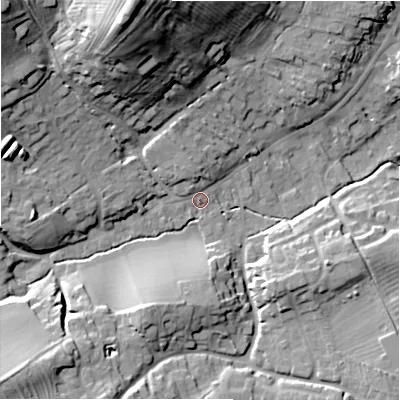 Shaded relief map of the ground around GL556DY, computed from Environment Agency LiDAR. The ground here sits at about 142 m above sea level and falls 42 m across the surrounding 800 m. Surface water reaching this point runs off ground lying to the north-north-west, 37.3 m higher.