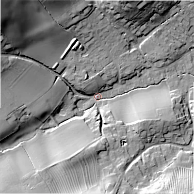 Shaded relief map of the ground around GL556EB, computed from Environment Agency LiDAR. The ground here sits at about 143 m above sea level and falls 47 m across the surrounding 800 m. Surface water reaching this point runs off ground lying to the north-west, 43.1 m higher.