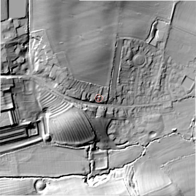 Shaded relief map of the ground around GL556HY, computed from Environment Agency LiDAR. The ground here sits at about 138 m above sea level and falls 33 m across the surrounding 800 m. Surface water reaching this point runs off ground lying to the west-north-west, 12.1 m higher.