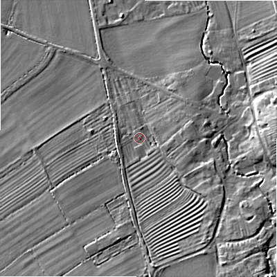 Shaded relief map of the ground around GL556QL, computed from Environment Agency LiDAR. The ground here sits at about 69 m above sea level and falls 16 m across the surrounding 800 m. Surface water reaching this point runs off ground lying to the south, 8.1 m higher.