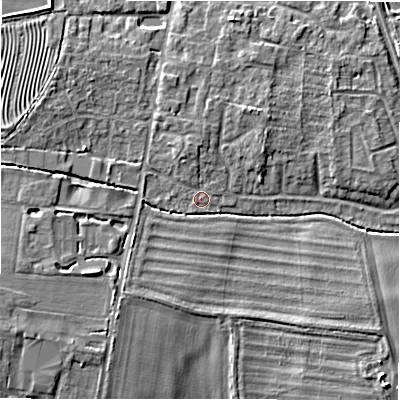 Shaded relief map of the ground around GL560DT, computed from Environment Agency LiDAR. The ground here sits at about 127 m above sea level and falls 7 m across the surrounding 800 m. Surface water reaching this point runs off ground lying to the west-north-west, 3.1 m higher.