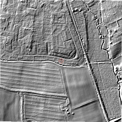 Shaded relief map of the ground around GL560EA, computed from Environment Agency LiDAR. The ground here sits at about 125 m above sea level and falls 7 m across the surrounding 800 m. Surface water reaching this point runs off ground lying to the west-north-west, 4.1 m higher.