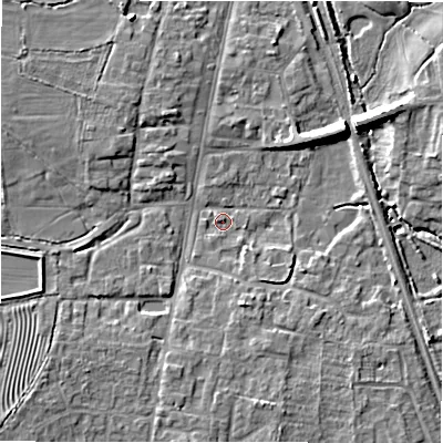 Shaded relief map of the ground around GL560JX, computed from Environment Agency LiDAR. The ground here sits at about 127 m above sea level and falls 9 m across the surrounding 800 m. Surface water reaching this point runs off ground lying to the west-north-west, 4.8 m higher.