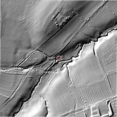 Shaded relief map of the ground around GL569JT, computed from Environment Agency LiDAR. The ground here sits at about 110 m above sea level and falls 24 m across the surrounding 800 m. Surface water reaching this point runs off ground lying to the north-north-west, 15.2 m higher.