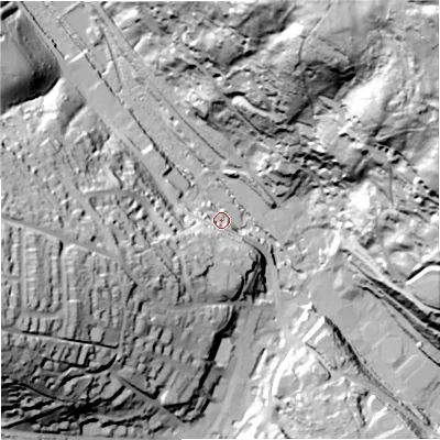 Shaded relief map of the ground around GL60AE, computed from Environment Agency LiDAR. The ground here sits at about 61 m above sea level and falls 118 m across the surrounding 800 m. Surface water reaching this point runs off ground lying to the north-east, 115.5 m higher.