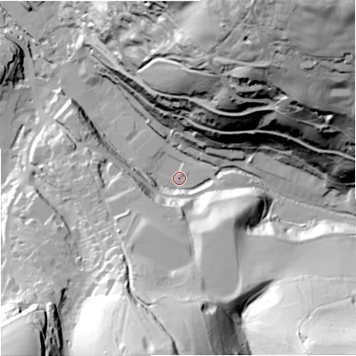 Shaded relief map of the ground around GL60BS, computed from Environment Agency LiDAR. The ground here sits at about 61 m above sea level and falls 106 m across the surrounding 800 m. Surface water reaching this point runs off ground lying to the north-east, 102.1 m higher.