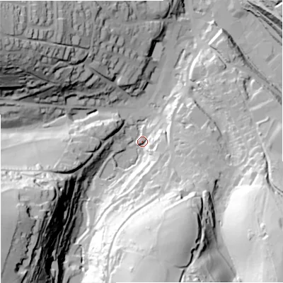 Shaded relief map of the ground around GL60JN, computed from Environment Agency LiDAR. The ground here sits at about 65 m above sea level and falls 74 m across the surrounding 800 m. Surface water reaching this point runs off ground lying to the south-west, 66.4 m higher.