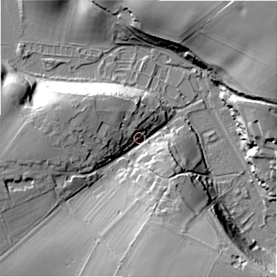 Shaded relief map of the ground around GL75NL, computed from Environment Agency LiDAR. The ground here sits at about 115 m above sea level and falls 43 m across the surrounding 800 m. Surface water reaching this point runs off ground lying to the south, 25.8 m higher.