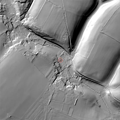 Shaded relief map of the ground around GL77AQ, computed from Environment Agency LiDAR. The ground here sits at about 129 m above sea level and falls 44 m across the surrounding 800 m. Surface water reaching this point runs off ground lying to the west, 16.4 m higher.