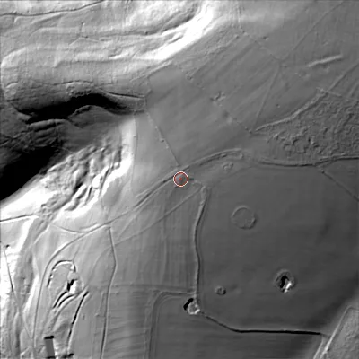 Shaded relief map of the ground around GL77EL, computed from Environment Agency LiDAR. The ground here sits at about 235 m above sea level and falls 65 m across the surrounding 800 m. Surface water reaching this point runs off ground lying to the east-north-east, 5.7 m higher.