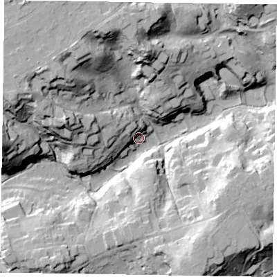 Shaded relief map of the ground around GU103QS, computed from Environment Agency LiDAR. The ground here sits at about 73 m above sea level and falls 40 m across the surrounding 800 m. Surface water reaching this point runs off ground lying to the west-north-west, 38.9 m higher.