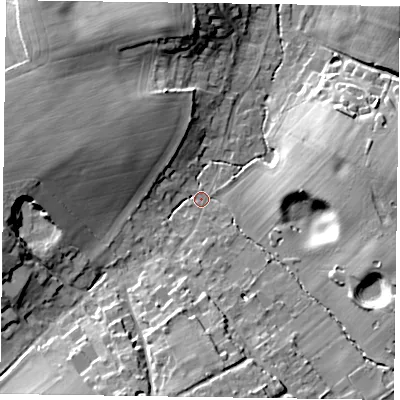 Shaded relief map of the ground around GU105QX, computed from Environment Agency LiDAR. The ground here sits at about 84 m above sea level and falls 15 m across the surrounding 800 m. Surface water reaching this point runs off ground lying to the west, 12.0 m higher.
