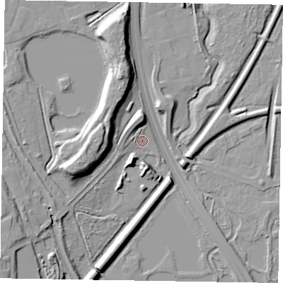 Shaded relief map of the ground around GU112PU, computed from Environment Agency LiDAR. The ground here sits at about 69 m above sea level and falls 21 m across the surrounding 800 m. Surface water reaching this point runs off ground lying to the west, 2.4 m higher.