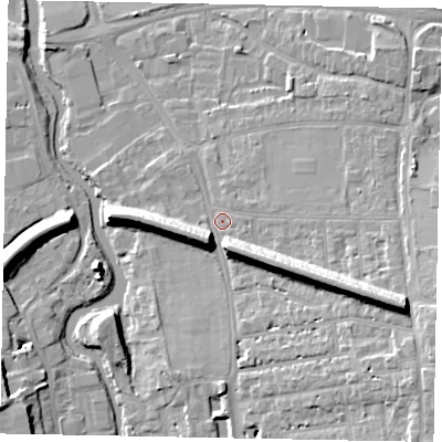 Shaded relief map of the ground around GU11ED, computed from Environment Agency LiDAR. The ground here sits at about 33 m above sea level and falls 16 m across the surrounding 800 m. Surface water reaching this point runs off ground lying to the east-south-east, 12.9 m higher.