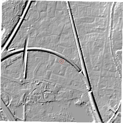 Shaded relief map of the ground around GU125AW, computed from Environment Agency LiDAR. The ground here sits at about 69 m above sea level and falls 13 m across the surrounding 800 m. Surface water reaching this point runs off ground lying to the east-south-east, 4.9 m higher.