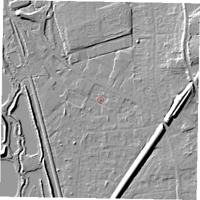 Shaded relief map of the ground around GU125QW, computed from Environment Agency LiDAR. The ground here sits at about 67 m above sea level and falls 13 m across the surrounding 800 m. Surface water reaching this point runs off ground lying to the east-south-east, 9.6 m higher.