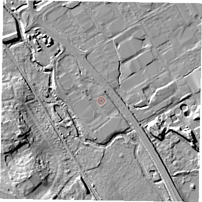 Shaded relief map of the ground around GU153DT, computed from Environment Agency LiDAR. The ground here sits at about 59 m above sea level and falls 15 m across the surrounding 800 m. Surface water reaching this point runs off ground lying to the south-east, 2.4 m higher.
