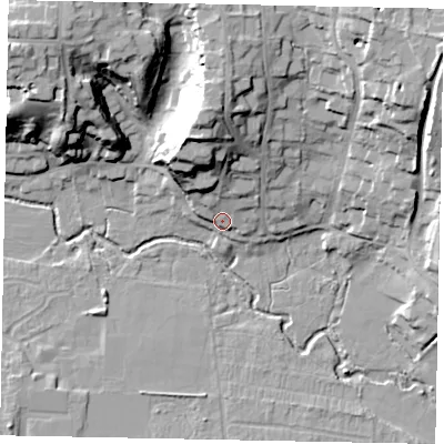 Shaded relief map of the ground around GU227LN, computed from Environment Agency LiDAR. The ground here sits at about 26 m above sea level and falls 25 m across the surrounding 800 m. Surface water reaching this point runs off ground lying to the north-north-west, 15.3 m higher.