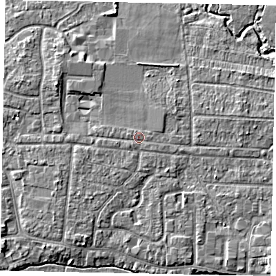 Shaded relief map of the ground around GU229DN, computed from Environment Agency LiDAR. The ground here sits at about 24 m above sea level and falls 5 m across the surrounding 800 m. Surface water reaching this point runs off ground lying to the west-south-west, 0.9 m higher.