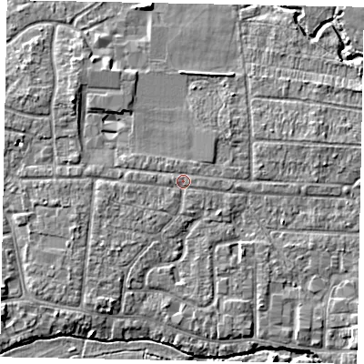 Shaded relief map of the ground around GU229DU, computed from Environment Agency LiDAR. The ground here sits at about 24 m above sea level and falls 5 m across the surrounding 800 m. Surface water reaching this point runs off ground lying to the west, 1.0 m higher.