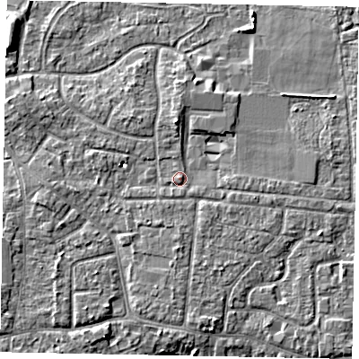 Shaded relief map of the ground around GU229DW, computed from Environment Agency LiDAR. The ground here sits at about 25 m above sea level and falls 7 m across the surrounding 800 m. Surface water reaching this point runs off ground lying to the north, 3.0 m higher.