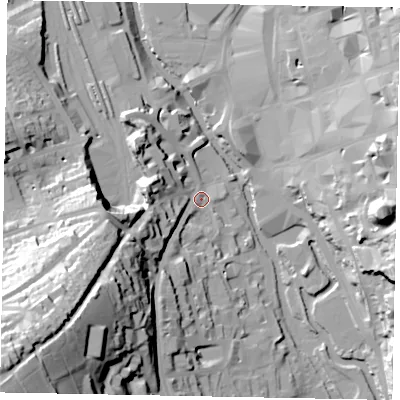 Shaded relief map of the ground around GU24BL, computed from Environment Agency LiDAR. The ground here sits at about 33 m above sea level and falls 74 m across the surrounding 800 m. Surface water reaching this point runs off ground lying to the south-west, 71.4 m higher.