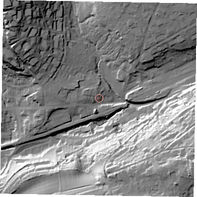 Shaded relief map of the ground around GU271BX, computed from Environment Agency LiDAR. The ground here sits at about 136 m above sea level and falls 57 m across the surrounding 800 m. Surface water reaching this point runs off ground lying to the west, 10.1 m higher.
