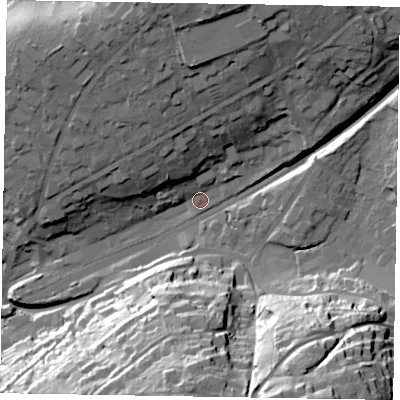 Shaded relief map of the ground around GU271DW, computed from Environment Agency LiDAR. The ground here sits at about 141 m above sea level and falls 58 m across the surrounding 800 m. Surface water reaching this point runs off ground lying to the north, 14.6 m higher.