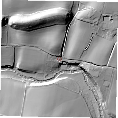 Shaded relief map of the ground around GU299RS, computed from Environment Agency LiDAR. The ground here sits at about 30 m above sea level and falls 42 m across the surrounding 800 m. Surface water reaching this point runs off ground lying to the north, 32.3 m higher.