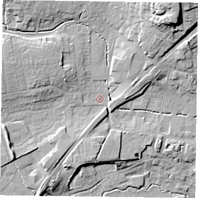 Shaded relief map of the ground around GU323AR, computed from Environment Agency LiDAR. The ground here sits at about 65 m above sea level and falls 29 m across the surrounding 800 m. Surface water reaching this point runs off ground lying to the west-north-west, 8.4 m higher.