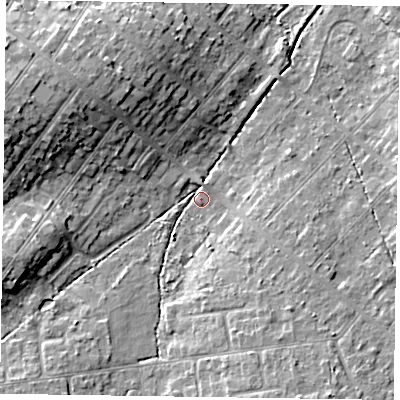 Shaded relief map of the ground around GU513AQ, computed from Environment Agency LiDAR. The ground here sits at about 70 m above sea level and falls 13 m across the surrounding 800 m. Surface water reaching this point runs off ground lying to the west-north-west, 11.4 m higher.