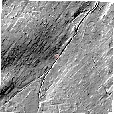 Shaded relief map of the ground around GU513BE, computed from Environment Agency LiDAR. The ground here sits at about 70 m above sea level and falls 12 m across the surrounding 800 m. Surface water reaching this point runs off ground lying to the west-north-west, 11.6 m higher.