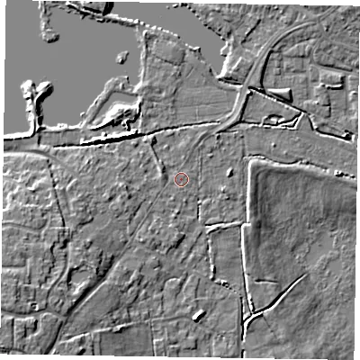 Shaded relief map of the ground around GU99LT, computed from Environment Agency LiDAR. The ground here sits at about 74 m above sea level and falls 12 m across the surrounding 800 m. Surface water reaching this point runs off ground lying to the south-west, 7.8 m higher.