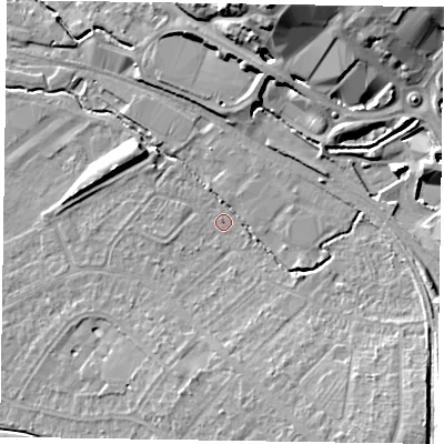 Shaded relief map of the ground around HP218JX, computed from Environment Agency LiDAR. The ground here sits at about 76 m above sea level and falls 17 m across the surrounding 800 m. Surface water reaching this point runs off ground lying to the north-north-east, 7.7 m higher.