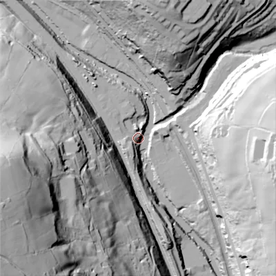 Shaded relief map of the ground around HX26AE, computed from Environment Agency LiDAR. The ground here sits at about 90 m above sea level and falls 119 m across the surrounding 800 m. Surface water reaching this point runs off ground lying to the south-west, 13.5 m higher.