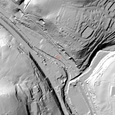 Shaded relief map of the ground around HX26AF, computed from Environment Agency LiDAR. The ground here sits at about 87 m above sea level and falls 115 m across the surrounding 800 m. Surface water reaching this point runs off ground lying to the north-west, 20.5 m higher.