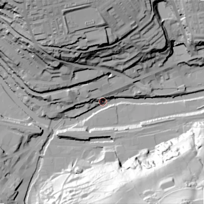 Shaded relief map of the ground around HX62JR, computed from Environment Agency LiDAR. The ground here sits at about 77 m above sea level and falls 101 m across the surrounding 800 m. Surface water reaching this point runs off ground lying to the south-south-east, 84.0 m higher.
